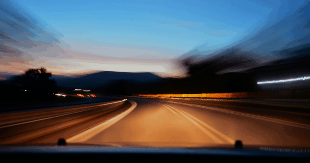 An mage of a road with a blur to make it look like the car is driving fast